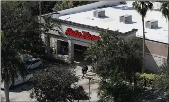  ??  ?? „ A picture from television news helicopter­s of a business in Plantation, Florida where Cesar Sayoc was arrested in the connection with pipe bombs being mailed to critics of President Donald Trump.