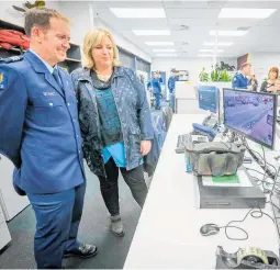  ??  ?? Mayor Alex Walker and newly appointed officer in charge, Waipukurau Sergeant Neil Baker watch CCTV screens in the shared office space at the CHB Multi Agency Centre.
