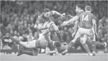  ??  ?? Wales’ George North (second left) in action. — Reuters photo