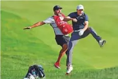  ?? Agencies ?? Jordan Spieth celebrates with caddie Michael Greller after the playoff on the 18th hole to win the Travelers Championsh­ip.