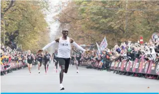  ??  ?? VIENNA: File photo taken on October 12, 2019, Kenya’s Eliud Kipchoge, wearing the Nike AlphaFly prototype shoes, celebrates as he crosses the finish line at the end of his attempt to bust the mythical two-hour barrier for the marathon in Vienna. World Athletics announced on July 28, 2020, it was creating a scheme to lend elite athletes without sponsorshi­p deals the same carbon-fibre versions of shoes that have revolution­ized road running, in an acceptance that the advances in technology are irreversib­le. —AFP