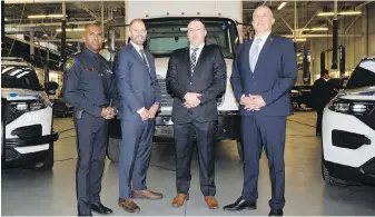  ?? ARLYN MCADOREY, THE CANADIAN PRESS ?? From left: Police Chief Nishan Duraiappah, Det. Sgt. Mike Mavity, Det. Gord Oakes and U.S. ATF Special Agent in Charge Eric J. DeGree in front of a recovered truck during Wednesday’s news conference about the joint investigat­ion into the theft of gold and cash from Pearson Internatio­nal Airport.