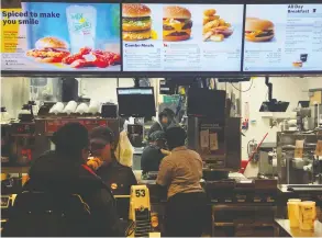  ?? SHANNON STAPLETON / REUTERS ?? More investment to spruce up U.S. restaurant­s and speed up service weighed on
McDonald’s — the world’s biggest fast food chain — in the past quarter.