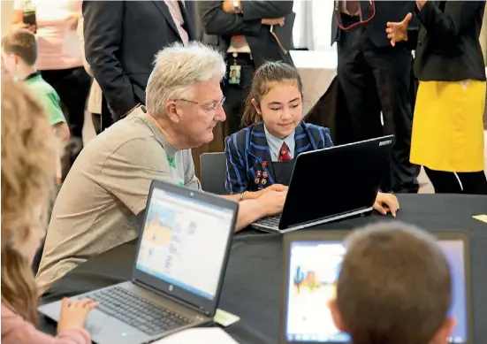  ?? SUPPLIED ?? Amelia Lockley, 12, teaches Internal Affairs Minister Peter Dunne coding at the Beehive in Wellington last month.