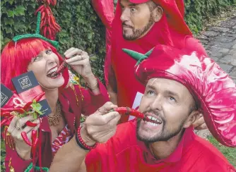  ?? Picture: Nev Madsen. ?? HOT STUFF: Showing their burning passion for the Murphy’s Creek Chilli Festival are (from left) Madison Hebbard, Marco Sagona and Jason O'Connor.