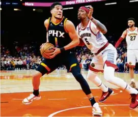  ?? MATT YORK/ASSOCIATED PRESS ?? Devin Booker and the Suns needed a home win to not fall in a 3-0 hole against Kentavious Caldwell-Pope and the Nuggets.