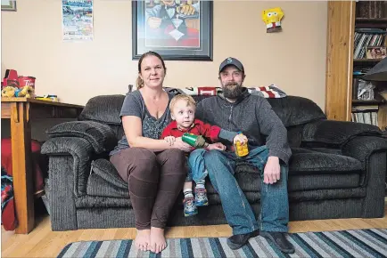  ?? JULIE JOCSAK THE ST. CATHARINES STANDARD ?? Jessica Tennyson, at home with her husband Mike Tennyson, son Jake Tennyson and mother Kim Graziano. When Jessica was thrown from a motorcycle 20 years ago, she suffered a traumatic brain injury. As a result, her doctor said she would never be able to get married, have children or live on her own. She has accomplish­ed all of these things.