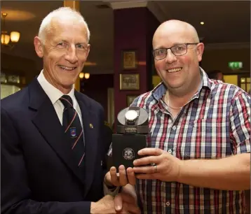  ??  ?? Martin Carroll presents his Captain’s prize in New Ross to Ger Ronan.