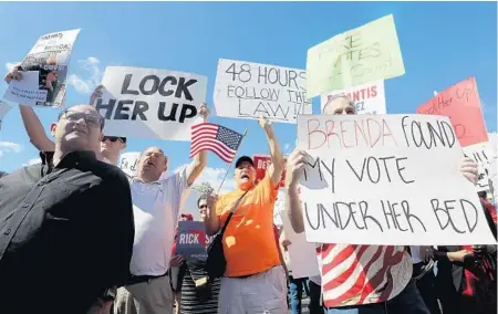  ?? MIKE STOCKER/SUN SENTINEL ?? Fueled by tweets from President Donald Trump, protesters gather outside as the Broward county canvassing board continues to count votes on Friday.