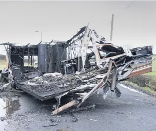  ??  ?? Gutted The burnt- out caravan in the A70 layby near Dobbies