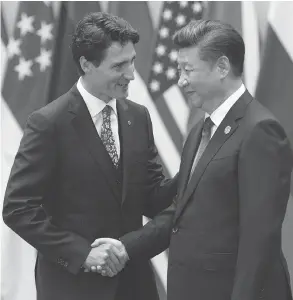  ?? ADRIAN WYLD / THE CANADIAN PRESS ?? Prime Minister Justin Trudeau and Chinese President Xi Jinping meet in Hangzhou in 2016. Canadians are looking more toward China for trade, according to a recent poll.