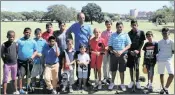  ??  ?? Golf coach Rowan Ramtahal with some of the junior players he coached on Sunday.