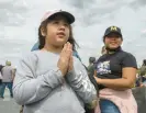  ?? ?? Crystal Guzman, 10, of East Chicago, looks on as her sister Nathalia, 8, prays.