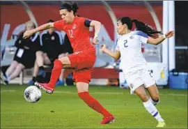  ?? Kevork Djansezian Getty Images ?? CHRISTINE SINCLAIR, left, dribbling against Costa Rica’s Gabriela Guillen, has single-handedly put Canada on the internatio­nal soccer map.