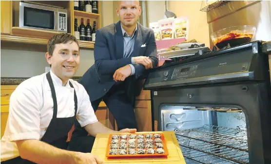  ?? DARREN MAKOWICHUK ?? Executive chef John MacNeil, left, and president Brad Kossowan of reTreat Edibles, which will sell mixes to start, and aims to later expand to grab-and-go edibles.