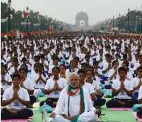  ?? (Adnan Abidi/Reuters) ?? INDIAN PRIME MINISTER Narendra Modi leads thousands of people in a session of yoga in New Delhi in June 2015 to mark the Internatio­nal Day of Yoga.