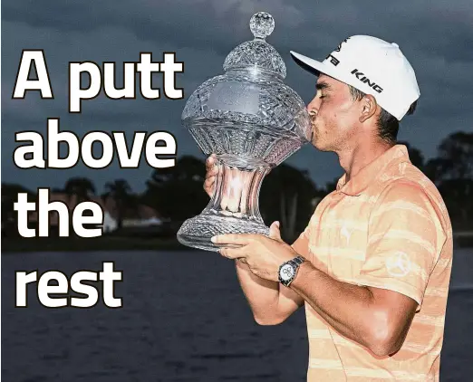  ??  ?? I deserve this: Rickie Fowler kissing the Honda Classic trophy in Palm Beach Gardens, Florida, on Sunday. — AP