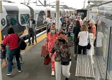  ?? TODD NIALL/ STUFF ?? Passengers arrive at Auckland’s Strand train station on the Te Huia service from Hamilton during the April school holidays and the half-price fare initiative.