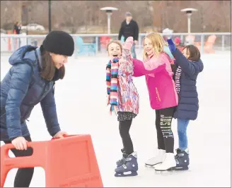  ?? Tyler Sizemore / Hearst Connecticu­t Media ?? Stamford’s Lyla Sutlif, left, 8, Addison Clear, center, 9, and Norwalk's Emma Seferidis, 8, skate together in a line at the Steven &amp; Alexandra Cohen Skating Center at Mill River Park in Stamford on Sunday. The new 9,000square-foot skating area opened Thursday and will be open seven days a week seasonally through March 15.