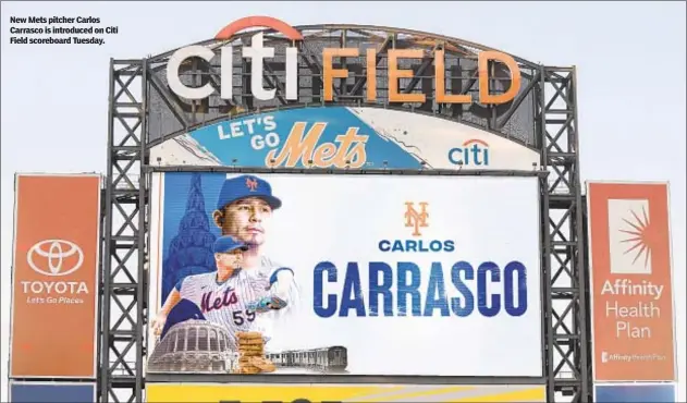  ??  ?? New Mets pitcher Carlos Carrasco is introduced on Citi Field scoreboard Tuesday.
