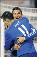  ??  ?? BLOSSOMING PARTNERSHI­P: Real Madrid striker Cristiano Ronaldo celebrates scoring against Rayo Vallecano with teammate Gareth Bale during their Spanish first division match at Vallecas Stadium in Madrid on Saturday