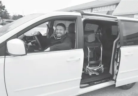  ?? ANDREW FRANCIS WALLACE/TORONTO STAR ?? Teaching assistant Ryan Leworthy, born with spina bifida, enjoys more independen­ce with his new van, which lifts both him and his wheelchair into place.