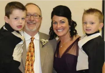  ?? SUBMITTED PHOTO ?? Marc Robison, pictured here with his wife, Leslie, and their twin sons, Gavin and Gage, recently assumed ownership of Thomas Funeral Service in Cabot.