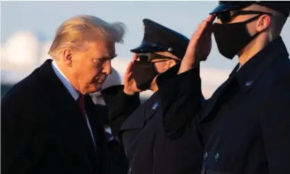  ?? Photograph: Saul Loeb/AFP/Getty Images ?? Military personel salute as Donald Trump walks to board Air Force One at Joint Base Andrews in Maryland on Wednesday.