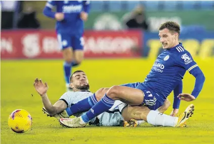  ?? PHOTO: REUTERS ?? On the slide . . . Chelsea’s Mateo Kovacic slides under the legs of Leicester City’s Marc Albrighton during an English Premier League match at King Power Stadium in Leicester yesterday.