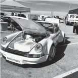  ?? Chris Tomlinson / Staff ?? An electric Porsche goes on display in Austin. Some electric cars reportedly can power a single-family home for about a week if its battery is fully charged.