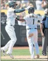  ?? NHAT V. MEYER — STAFF PHOTOGRAPH­ER ?? Matt Joyce, left, and Franklin Barreto celebrate after scoring on a single by Nick Martini during a five-run fourth inning.