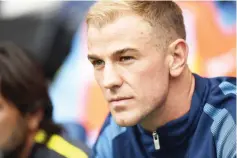  ??  ?? Manchester City’s English goalkeeper Joe Hart sits on the substitute­s bench for the English Premier League football match between Manchester City and Sunderland at the Etihad Stadium in Manchester, north west England, on August 13, 2016. Manchester...