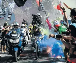  ?? Picture: Philippe Lopez/AFP PHOTO ?? Steven Kruijswijk of the Netherland­s rides through flare-bomb smoke during the 12th stage of the Tour de France cycling race on Thursday.