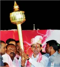  ?? PTI ?? TRS president K Chandrasek­har Rao holds a mace during an election meeting in Karimnagar district of Talengana. —