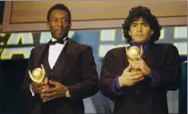  ?? FILE — THE ASSOCIATED PRESS ?? In this March 1987 file photo, Pele, left, and Maradona hold “Sports Oscar” trophies in Milan, Rome. The Argentine soccer great died from a heart attack on Wednesday at his home in Buenos Aires. He was 60.