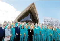  ??  ?? Sydney's Lord Mayor Clover Moore, center, poses for a picture with Australia's Olympic athletes returning from Rio during an official welcome ceremony at the Sydney Opera House in Australia Monday. (Reuters)