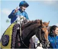  ??  ?? Joy: William Buick celebrates after riding Wuheida to victory in Filly And Mare Turf