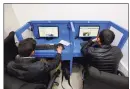  ?? Associated Press ?? Afghanis access social media websites at a private internet cafe in Kabul, Afghanista­n, in 2016.
