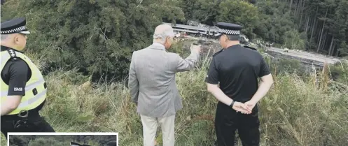  ??  ?? 0 Prince Charles visited the site of the crash near Stonehaven and spoke to emergency staff