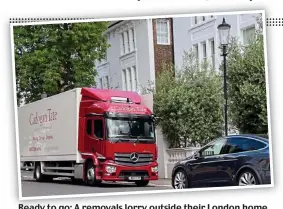  ?? ?? Ready to go: A removals lorry outside their London home