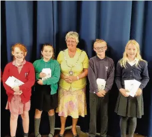  ??  ?? ●» Ellen Robinson, from Pott Shrigley, Millie Kenyon, from St John’s, Jack Allen and Katie Barber from Bollington Cross, were among the students presented with bibles from Mayor of Bollington Coun Angela Williams.