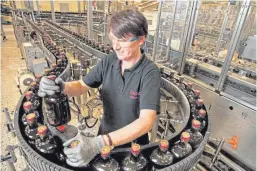  ??  ?? A worker on the production line at Diageo in Leven, Fife.