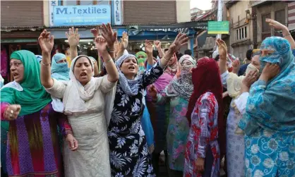  ?? Photograph: Zuma/Rex/Shuttersto­ck ?? A protest in Srinagar this month over alleged ‘braid choppings’.