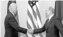  ?? ALEXANDER ZEMLIANICH­ENKO/AP ?? Then-Vice President Joe Biden, left, shakes hands with Russian Prime Minister Vladimir Putin in Moscow in 2011.