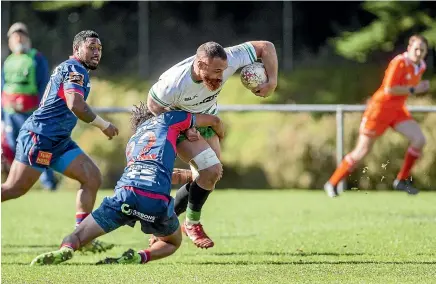  ?? WARWICK SMITH/STUFF ?? Brice Henderson tries to break the tackle of a Tasman defender. Henderson controlled the Turbos’ pack with Nick Croswell yesterday.