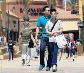  ?? Irfan Khan Los Angeles Times ?? EVEN CONVENTION­AL retailers such as Macy’s Inc. and J.C. Penney Co. have been closing shops. Above, Desert Hills Premium Outlets mall in Cabazon in 2014.