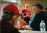  ?? L. GROSS / MINNEAPOLI­S STAR TRIBUNE SHARI ?? Richard Luedtke, center, leads conversati­on and prayer inside St. Stephen’s Catholic Church in Minneapoli­s.