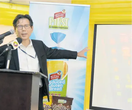  ?? FILE ?? Anthony Chang, managing director of Consolidat­ed Bakeries Jamaica/Purity Bakery, speaks at the launch of the Miss Birdie line of gluten-free products in June 2019.