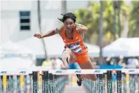  ?? MIAMI ATHLETICS/COURTESY ?? UM track standout Michelle Atherley worried a knee injury might have ended her career, but she endured months of painful rehabilita­tion to work her way back to elite competitio­n.