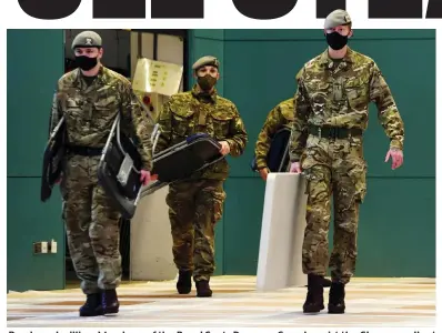  ??  ?? Ready and willing: Members of the Royal Scots Dragoon Guards assist the Glasgow rollout